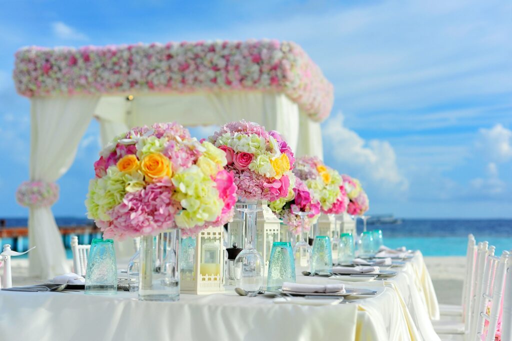 Consider the setting for your wedding when choosing flowers. This beach wedding has a bright tropical feel.