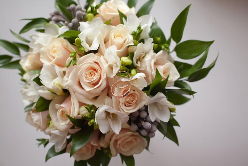 Choosing wedding flowers is one of the biggest decisions. This beautiful peachy toned hand tie bridal bouquet is lovely.