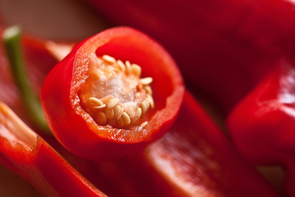 A close up of a chilli cut through for a post packed with advice to grow chilli plants yourself.