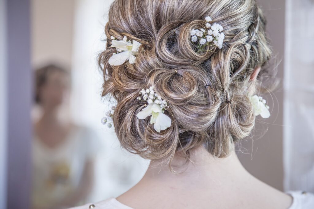 Flowers in your hair is a lovely way to make it look romantic when planning your wedding.